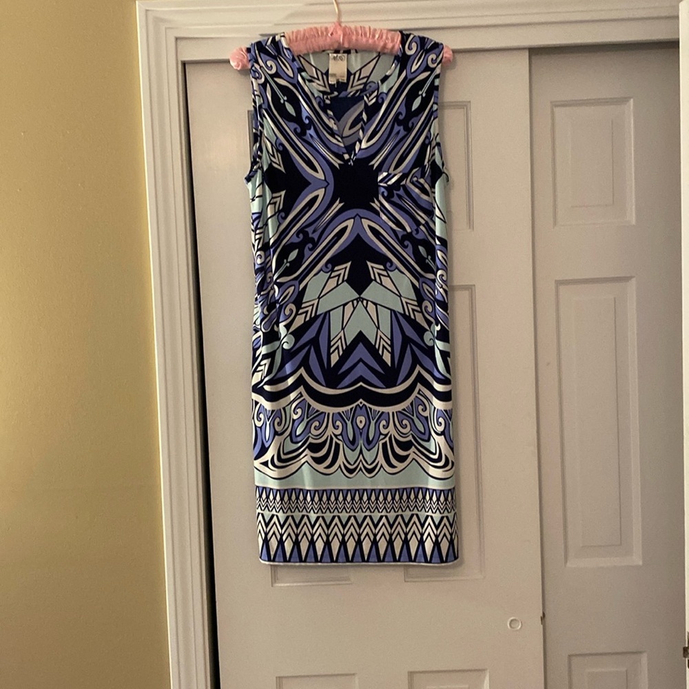 Sleeveless knee length h lightweight summer dress with small pocket in front.